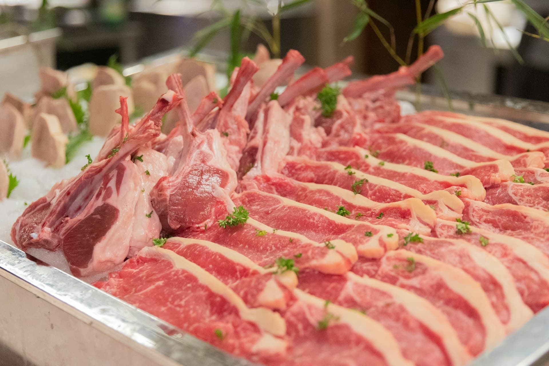 Fresh lamb chops and steaks on ice at the FreshCo Hub butcher counter